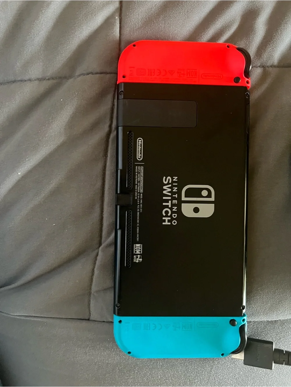 Nintendo Switch with Neon Blue & Neon Red Joy‑Con Controllers and Dock